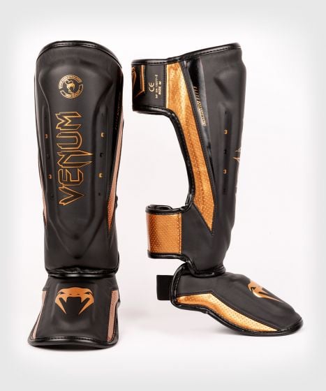 【15%OFF｜XLサイズ】VENUM Elite Evo シンガード｜本格派プロ仕様・耐久性・フィット感を追求（ブラック・ブロンズ）