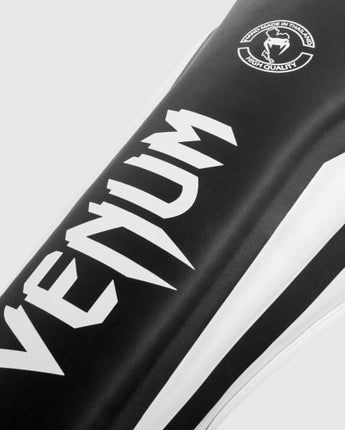 VENUM (ヴェナム/ベノム) エリートスタンドアップ シンガード レガース すねあて ブラック・ホワイト  UFC公式サプライヤー  高密度フォーム 2本マジックテープ(ベルクロ式)固定 トレーニング・スパーリング用 キックボクシング ムエタイ MMA 総合格闘技 空手