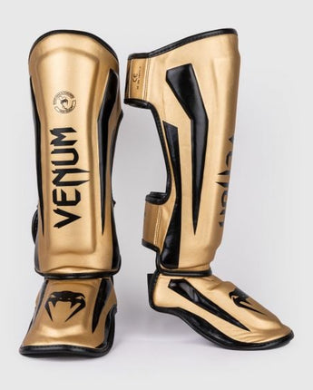 VENUM (ヴェナム/ベノム) エリートスタンドアップ シンガード レガース すねあて ゴールド・ブラック  UFC公式サプライヤー  高密度フォーム 2本マジックテープ(ベルクロ式)固定 トレーニング・スパーリング用 キックボクシング ムエタイ MMA 総合格闘技 空手